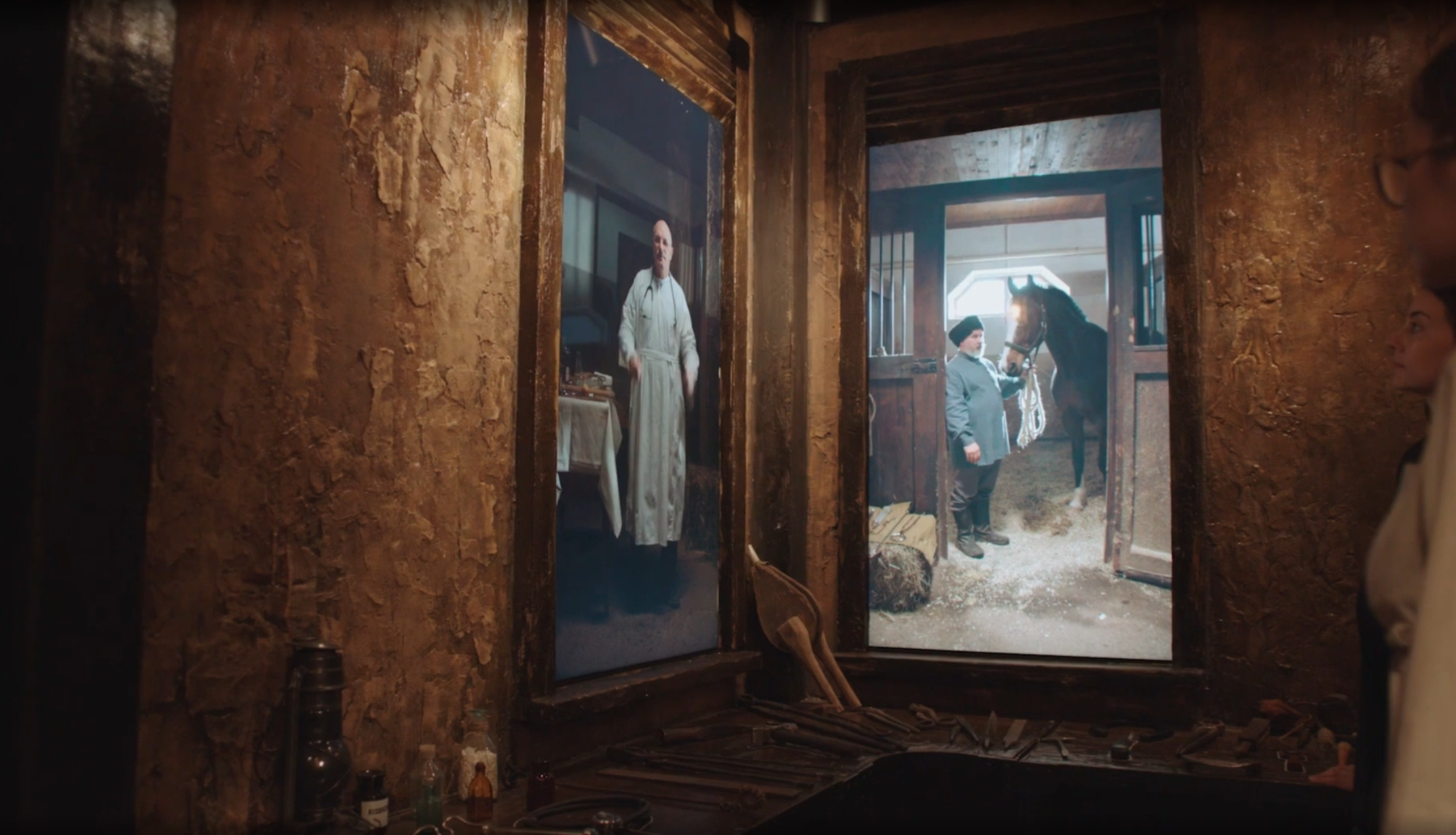 “Professions in the world of horses”: screens with craftsmen above a workbench with tools